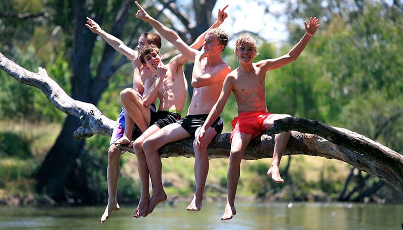 Teenagers at play at the river