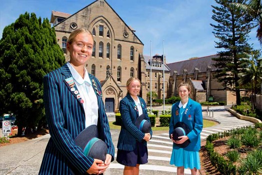 Senior Students standing in front of the Main Building